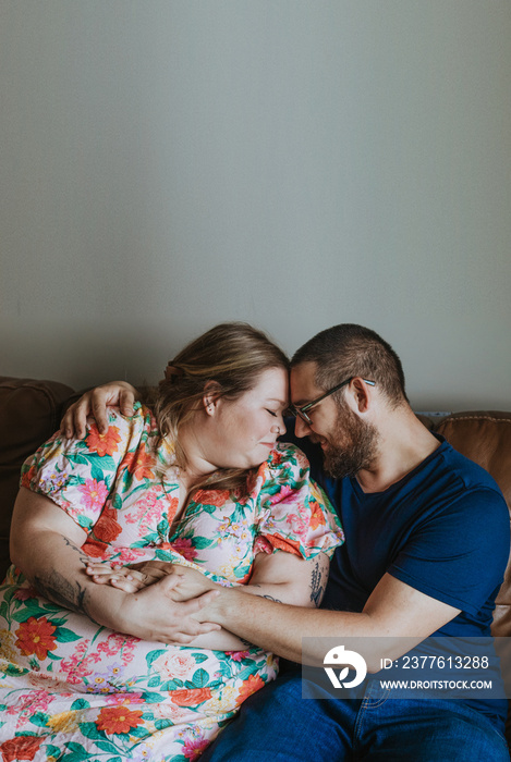 couple embraces heads together