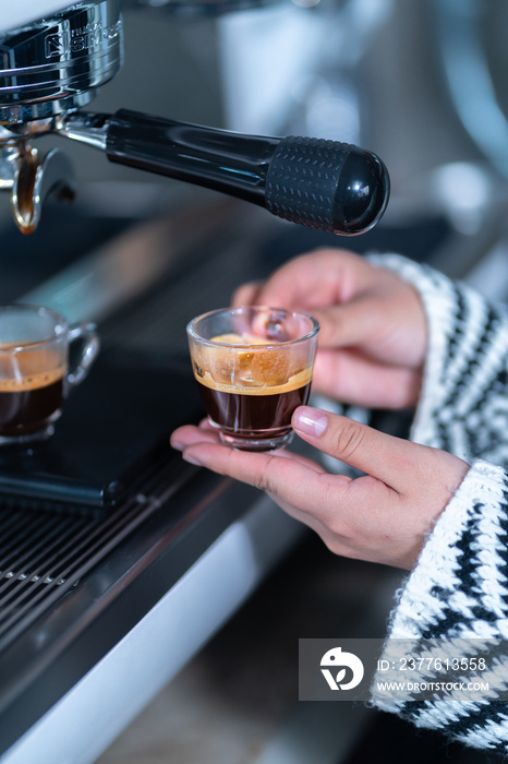 Preparing an express coffee in a professional coffee machine.