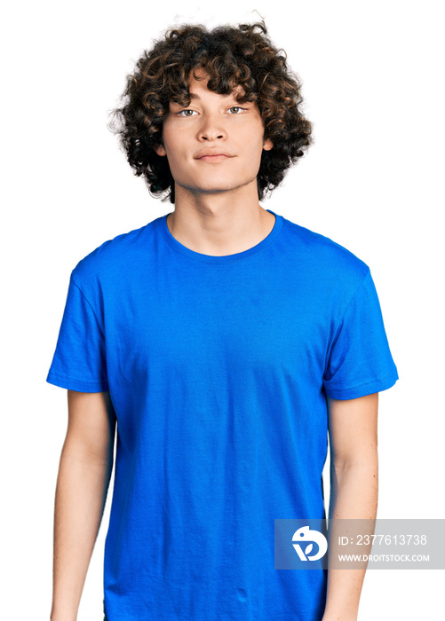 Caucasian teenager wearing casual clothes relaxed with serious expression on face. simple and natural looking at the camera.