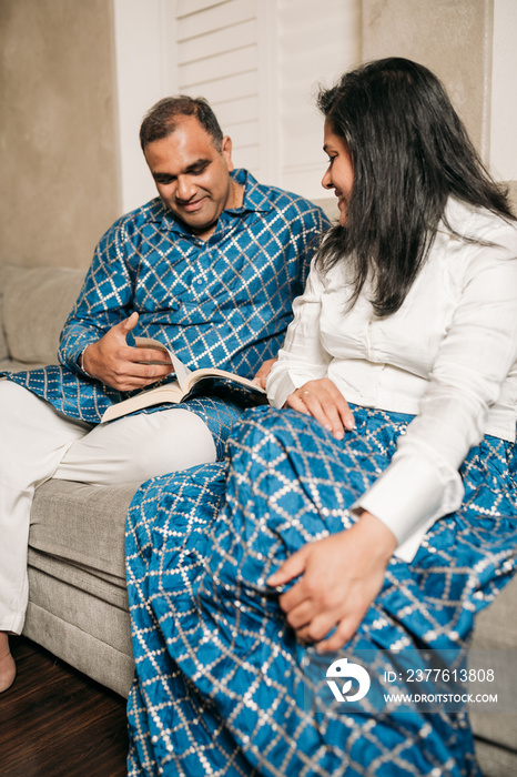 South Asian couple talking at home