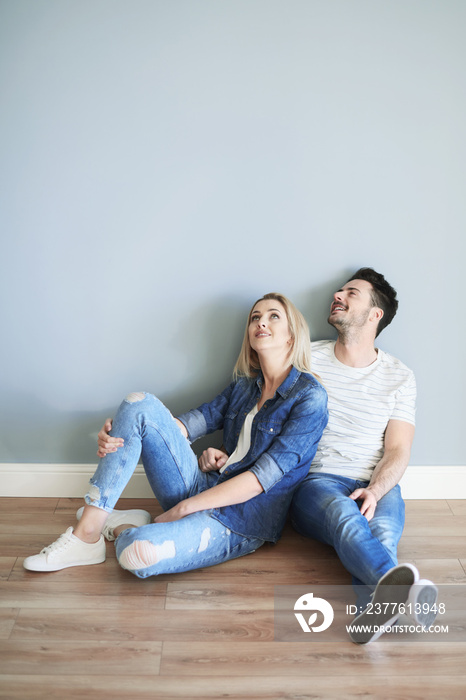 Young couple admiring home interior .