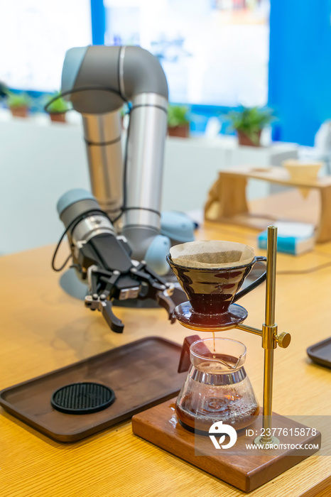 automatic arm preparing coffee in coffee machine