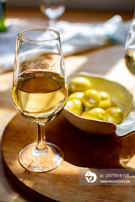 Sherry wine tasting, dry fino, manzanilla or palomino jerez fortified wine in glasses, Jerez de la Frontera, Andalusia, Spain