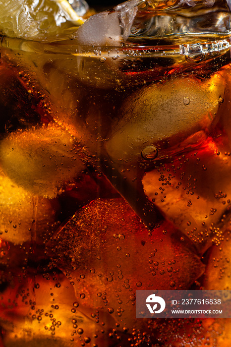 Cola with ice in a glass close-up. Pepsi, Coca-Cola