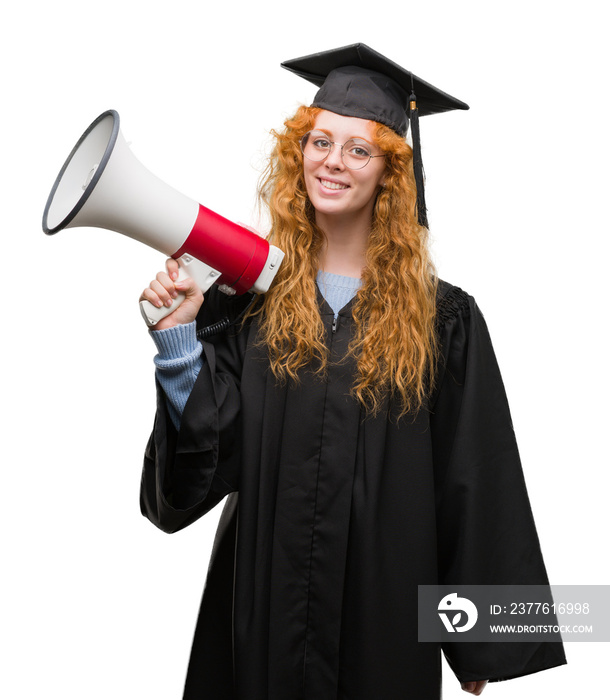 Young redhead student woman wearing graduated uniform holding megaphone with a happy face standing and smiling with a confident smile showing teeth