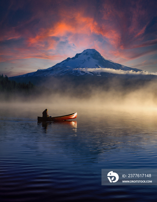 Sunset over Trillium Lake with canoe and Mt Hood with reflection, near Government camp oregon