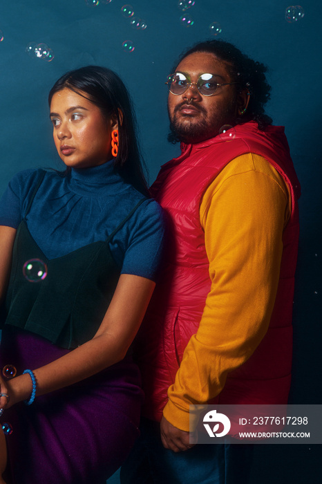 Asian duo colour blocked fashion studio portrait