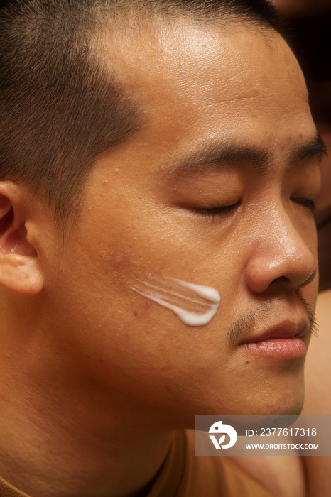 Asian male solo lifestyle studio portrait shot with eyes closed