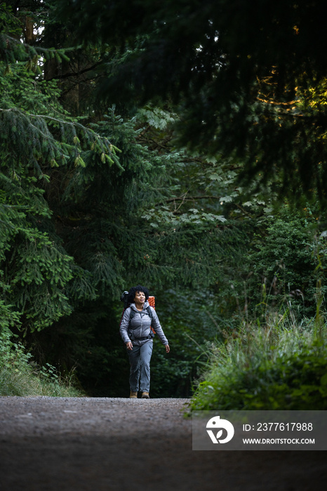 U.S. Army female soldier putting in the miles with an early morning hike in the NorthWest.