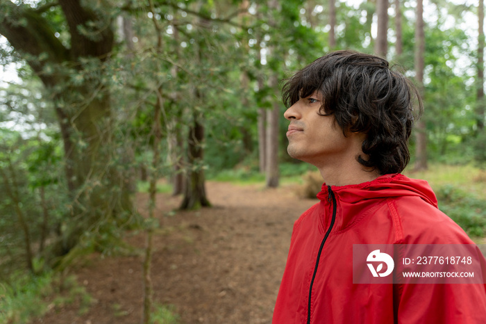 Young man hiking in forest