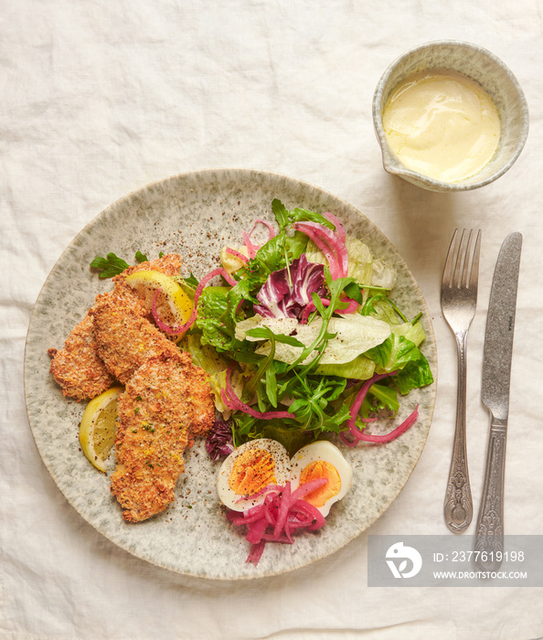 Crispy fried chicken with fresh salad