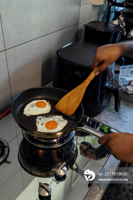 Couple making breakfast together at home in the morning