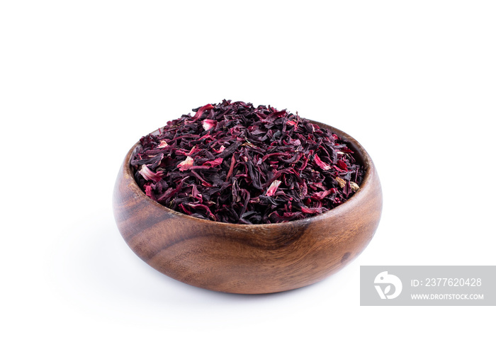 Dried red hibiscus tea in wooden bowl isolated on white