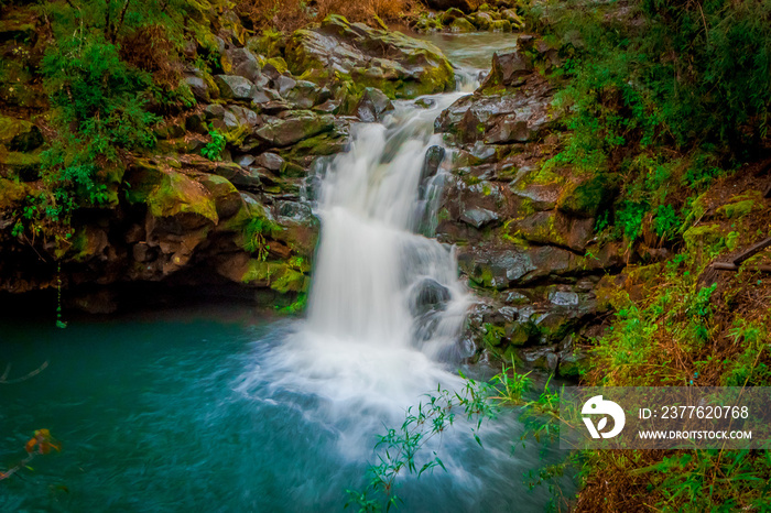 Beautiful outdoor view of long exposure of gorgeous waterfall located at Pucon, Chile