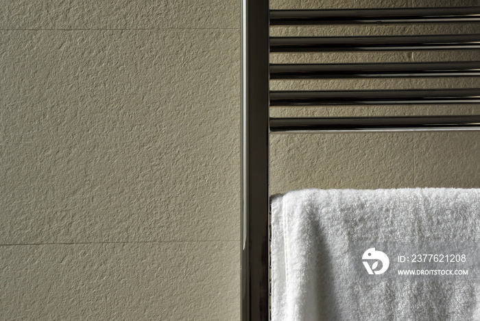 Towel over the bathroom heater, modern and cozy house