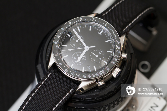 Close up on a chronograph wrist watch for man, no people are visible.