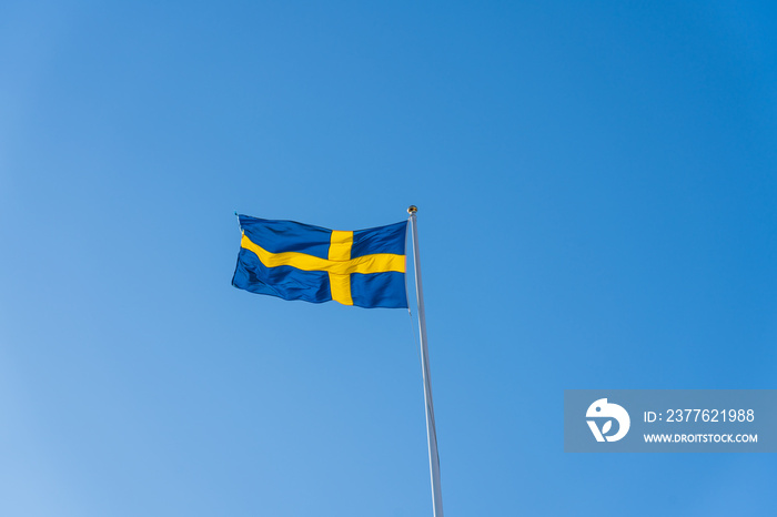 Swedish flag isolated on blue sky