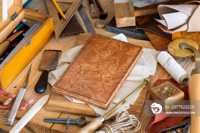 Still life of various tools for the craft of hands binding book