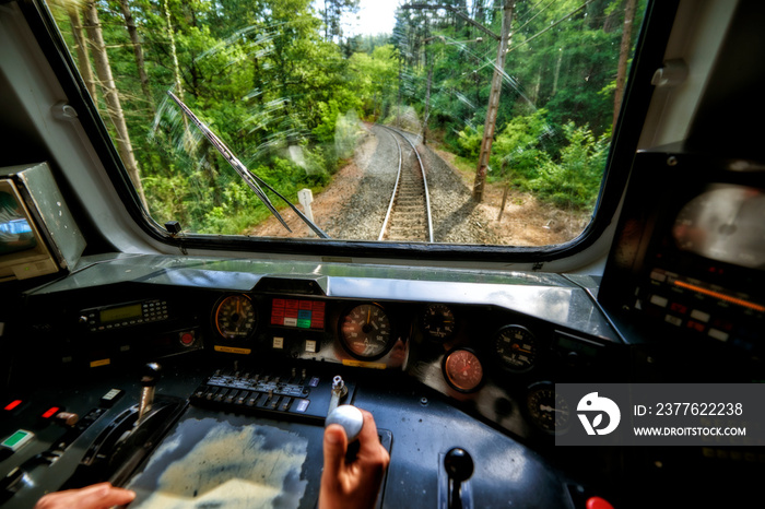 Interior view of the pilot hands and instrument panel cockpit of ancient train