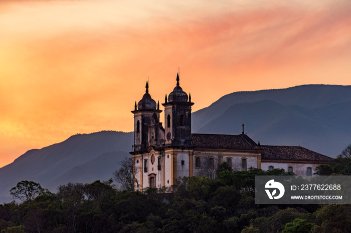 Historic baroque church on top of the hill during sunset in Ouro Preto city in Minas Gerais