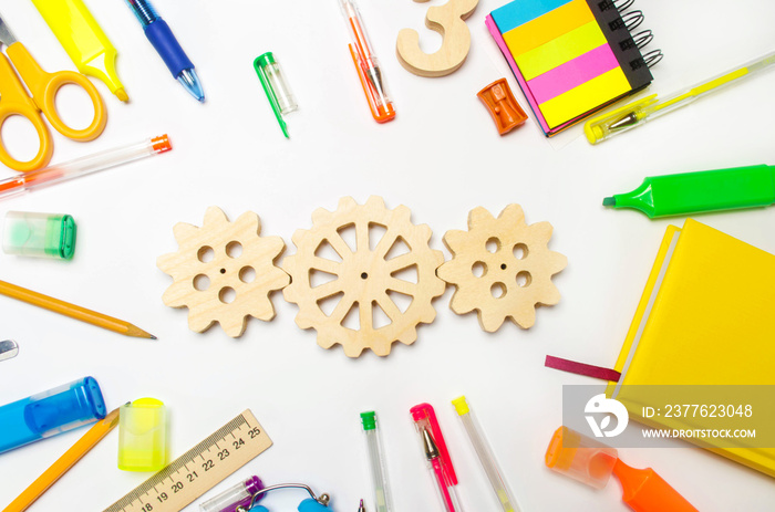 wooden gear on the creative school desk. educational process. mechanism interaction, principle of action. creativity and education system. development of young children. imagination, thinking