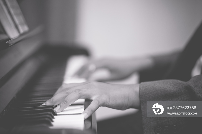 Man hands on grand piano for worship in Church.Male pianist Playing classic piano.Professional musician pianist hands on piano keys.