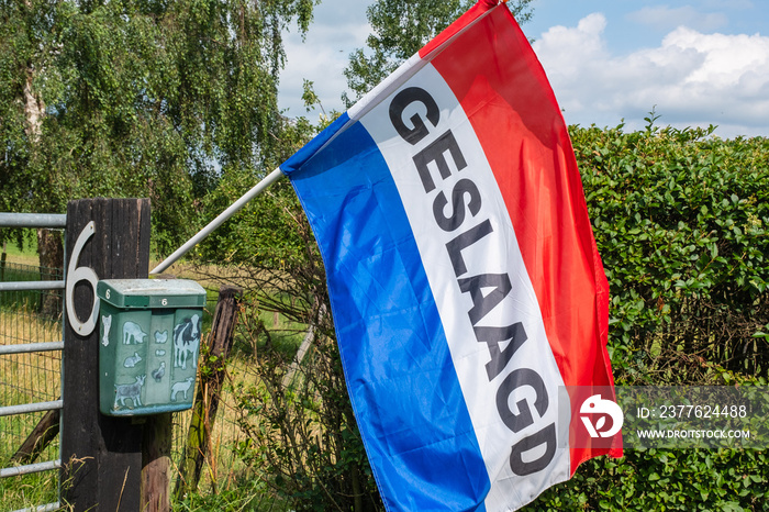 Traditional Dutch flag with text  Geslaagd  meaning someone has passed school exams