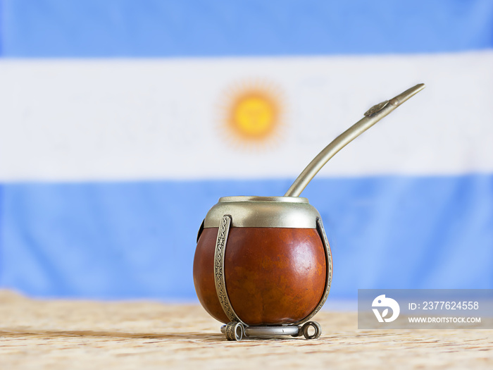 mate, mate grass (yerba mate) with flag of Argentina  in the background