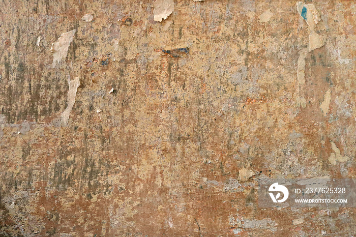 dirty and chipped vintage wall of paper over a grunge background wallpaper