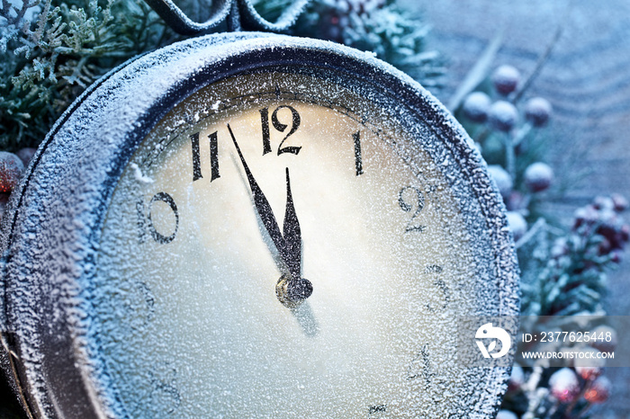 Five minutes to twelve. Snowy Christmas clocks.