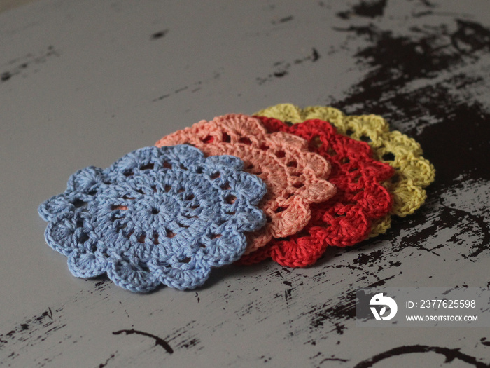 Colorful Cotton Handmade Doilies on rustic table