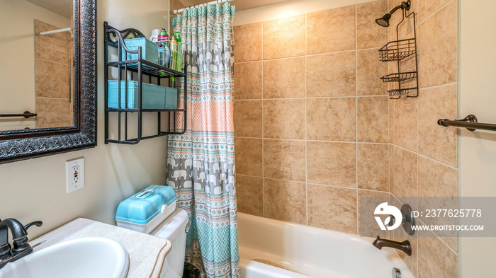 Pano Bathroom interior with antique fixtures and ceramic tile walls