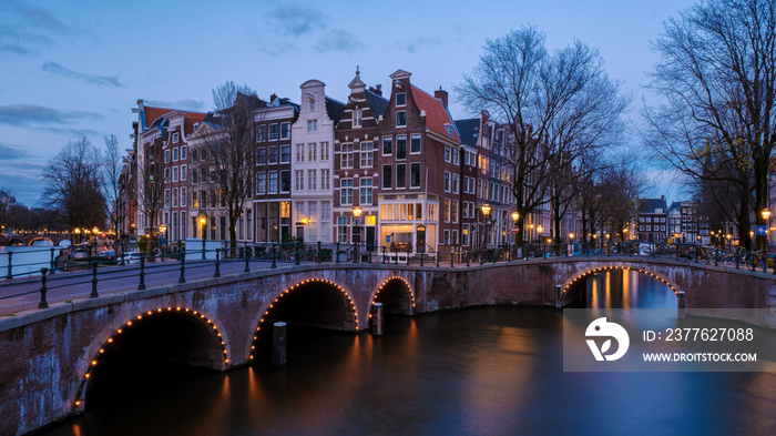 Amsterdam Netherlands canals with lights during the evening in December during wintertime in the Netherlands Amsterdam city. Europe.