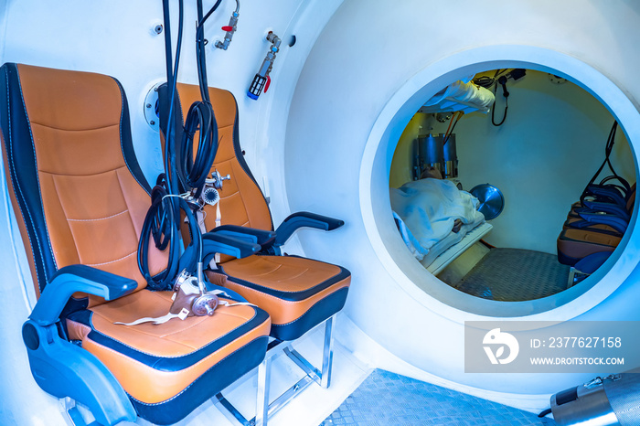 Pressure chamber for divers. Industrial diving. Means save divers. Safety of underwater diving. The chamber with chairs and a bed for divers. Equipment for sailors.