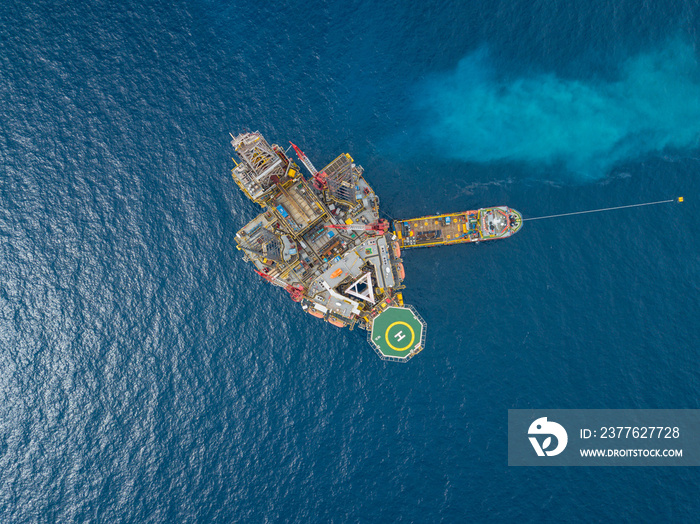 Aerial view from a drone of an offshore jack up rig at the offshore location during day time