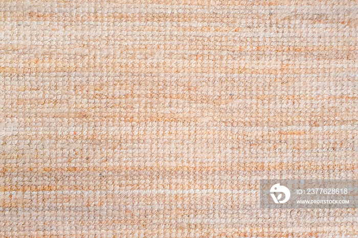 Beige light peach carpet texture background. Polypropylene carpet, close-up, top view, texture, braided rough pad beige