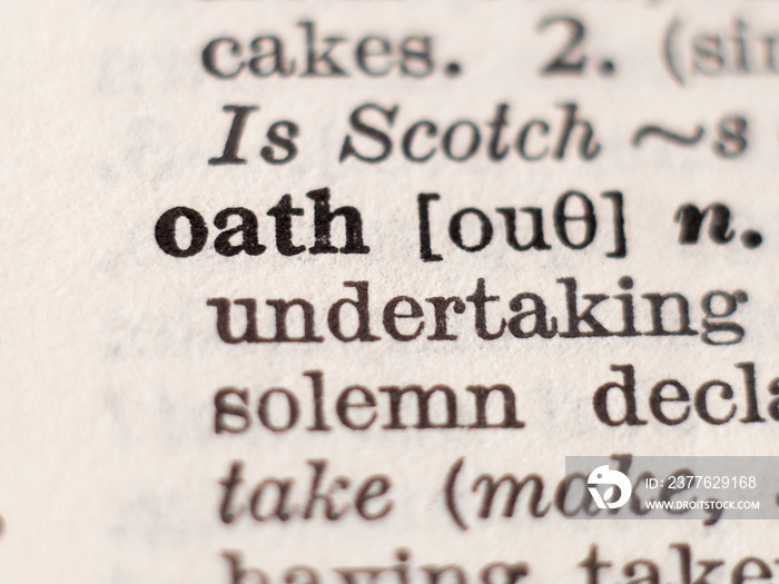 Dictionary definition of word oath, selective focus.