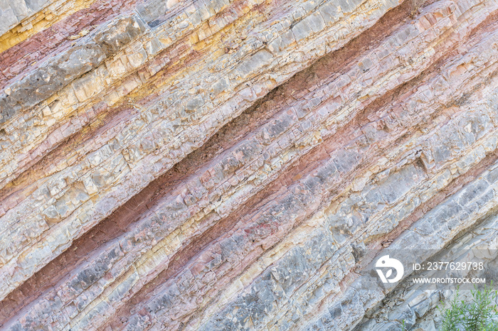 Curious rock formations on the side of a mountain, with detail of the veins and sedimentation layers.