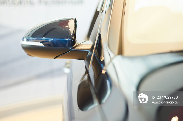 automobile rearview mirror of new modern car in showroom