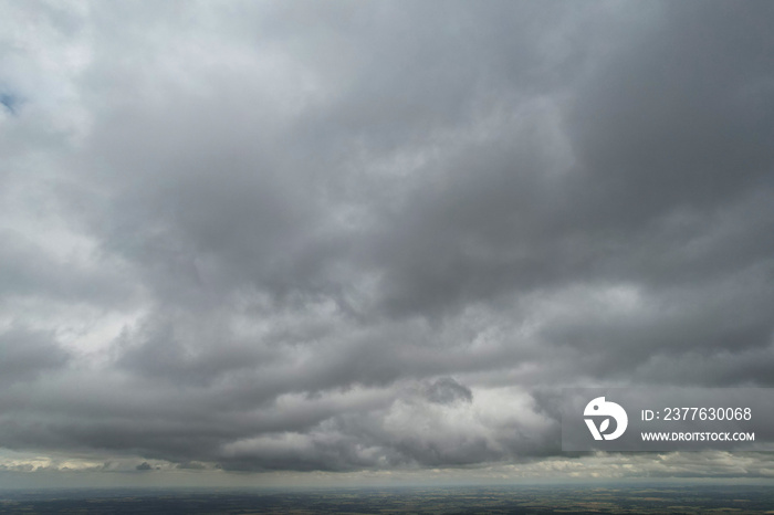 Aerial footage of Town and Thick Raining Clouds over England