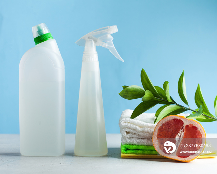 Eco-friendly product for General cleaning, washing on blue background. Household chemicals, cleaning concept. Copy space