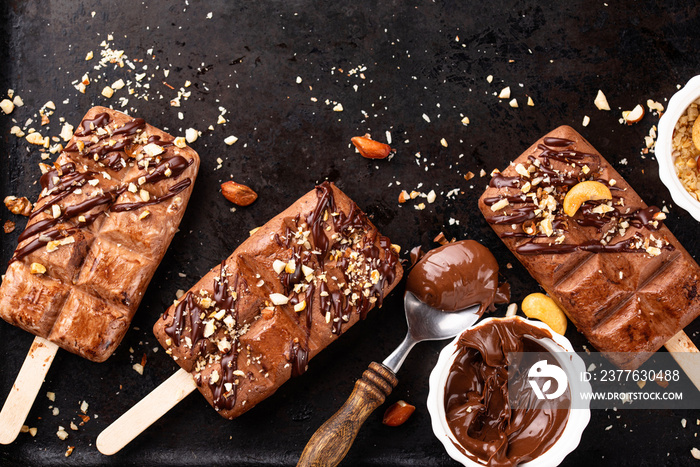 Chocolate ice cream popsicle with nut