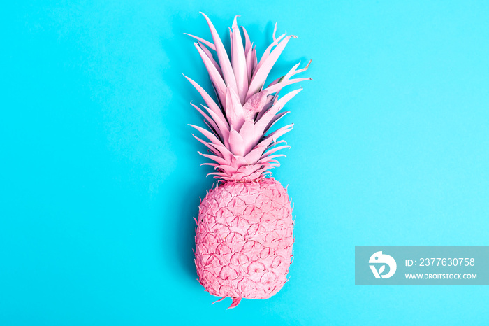 Pink pineapple on a blue background