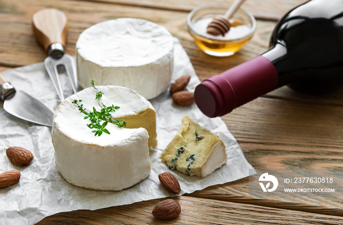 Various types of cheese,  blue cheese,  bree, camambert and wine