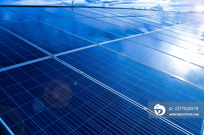 Closeup view of photovoltaic panels surface which installed on the building’s roof after washing and cleaning by the company’s staffs in the afternoon of the day.