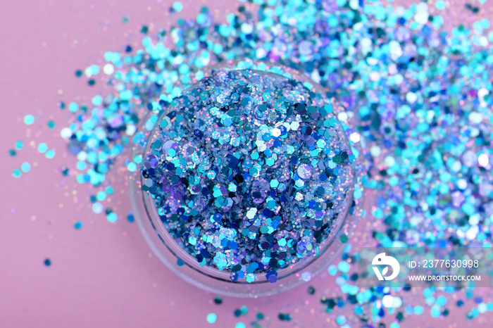 Blue shimmer and glitter in small plastic box.