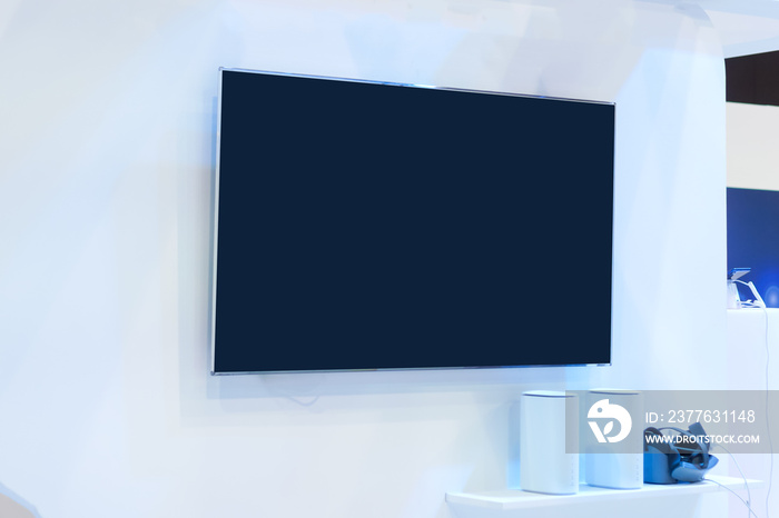 Blank lcd smart TV presentation at event convention exhibit trade show and booth in conference hall, white Mock up blank advertising on blue background