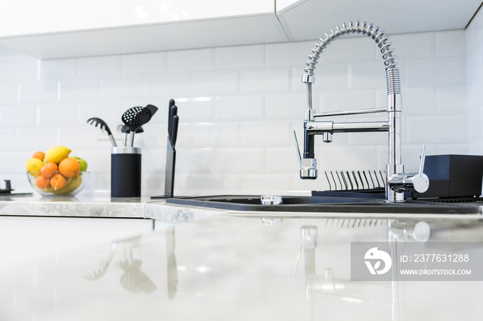 Fancy sink in a mostly white modern kitchen