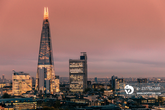 Modern London city skyline with shard building at sunset night