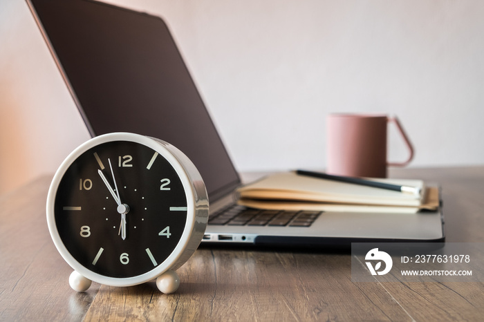 Working desk, Office and home office concept. with Laptop, Pencil, Clock, Milk cup on wooden table.